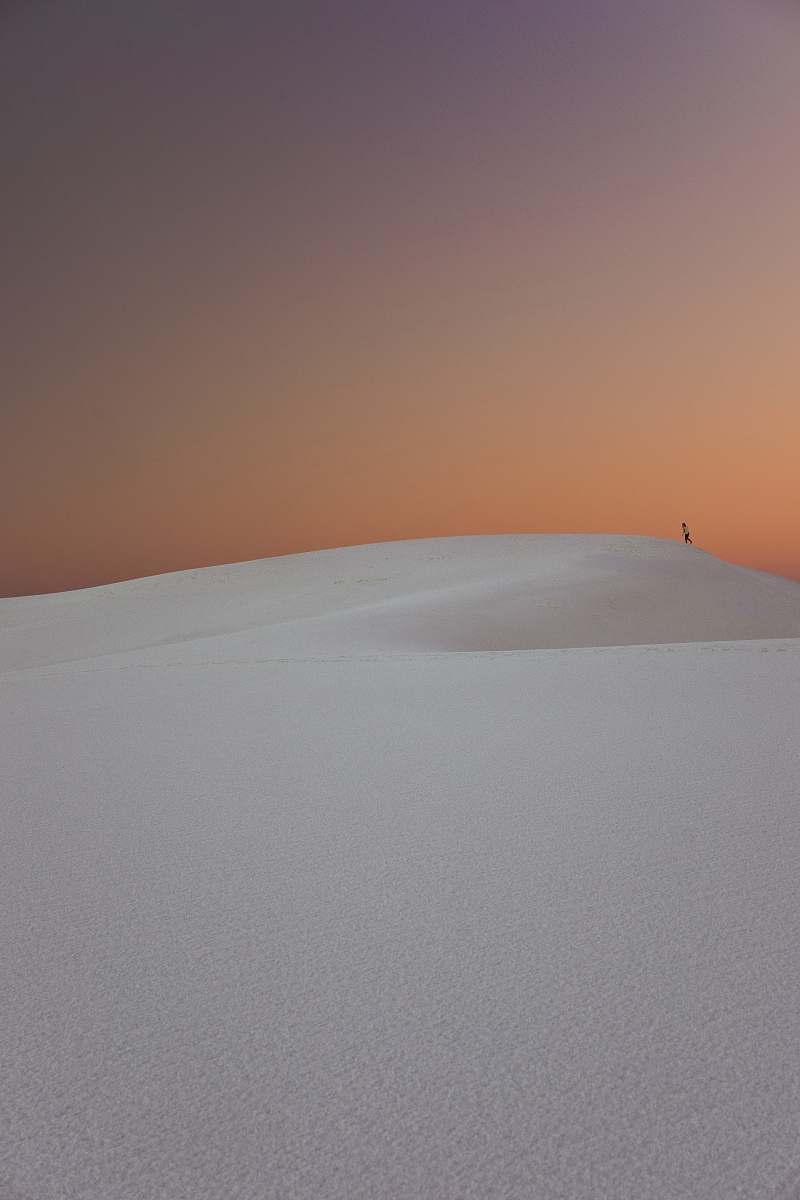 iphone wallpapers person walking in the desert dunes iphone backgrounds